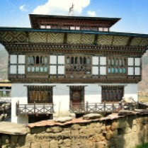 Houses in Bhutan are painted with religious images believed to protect it from evil spirits.